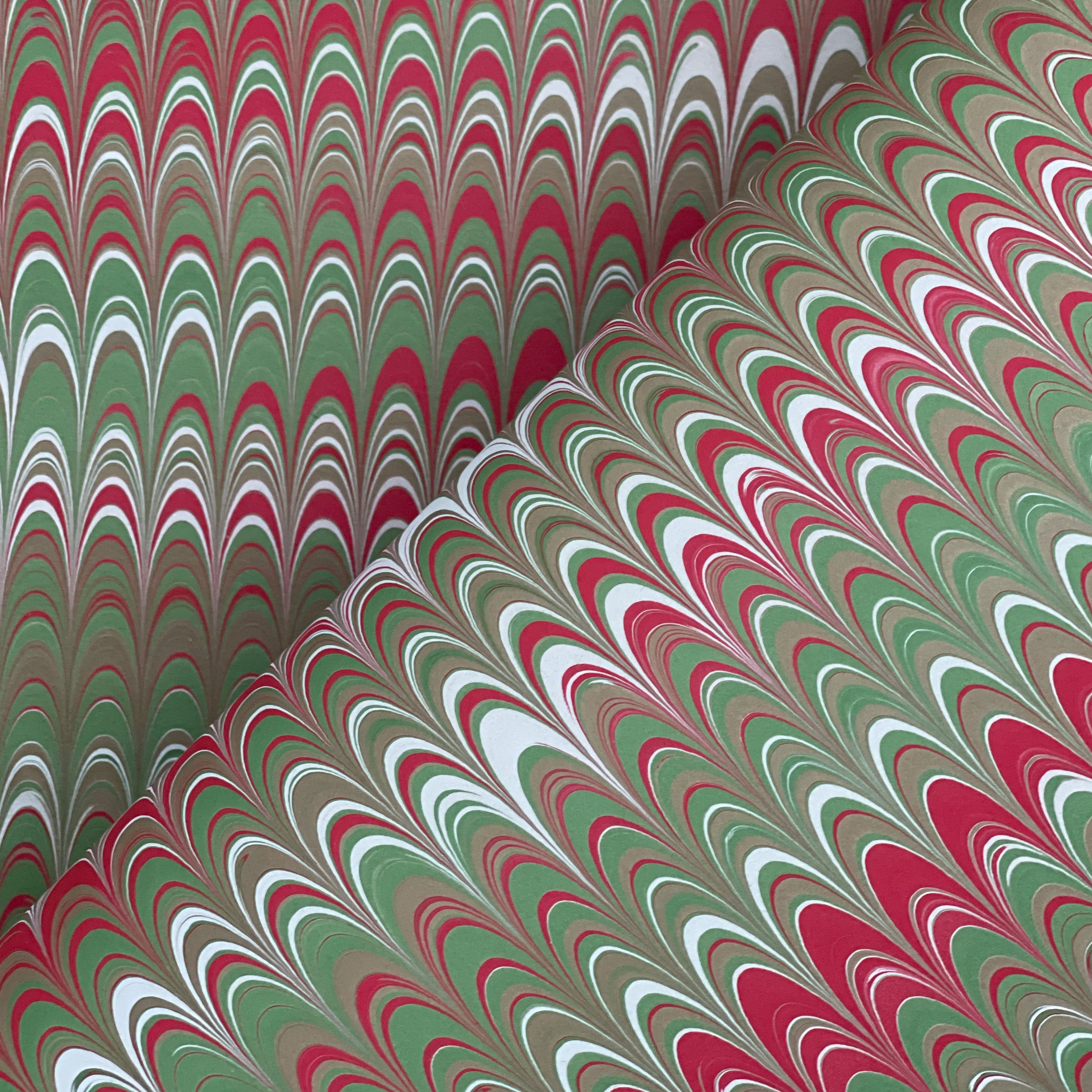 Marbled non-pareil paper with red, green, and white pattern
