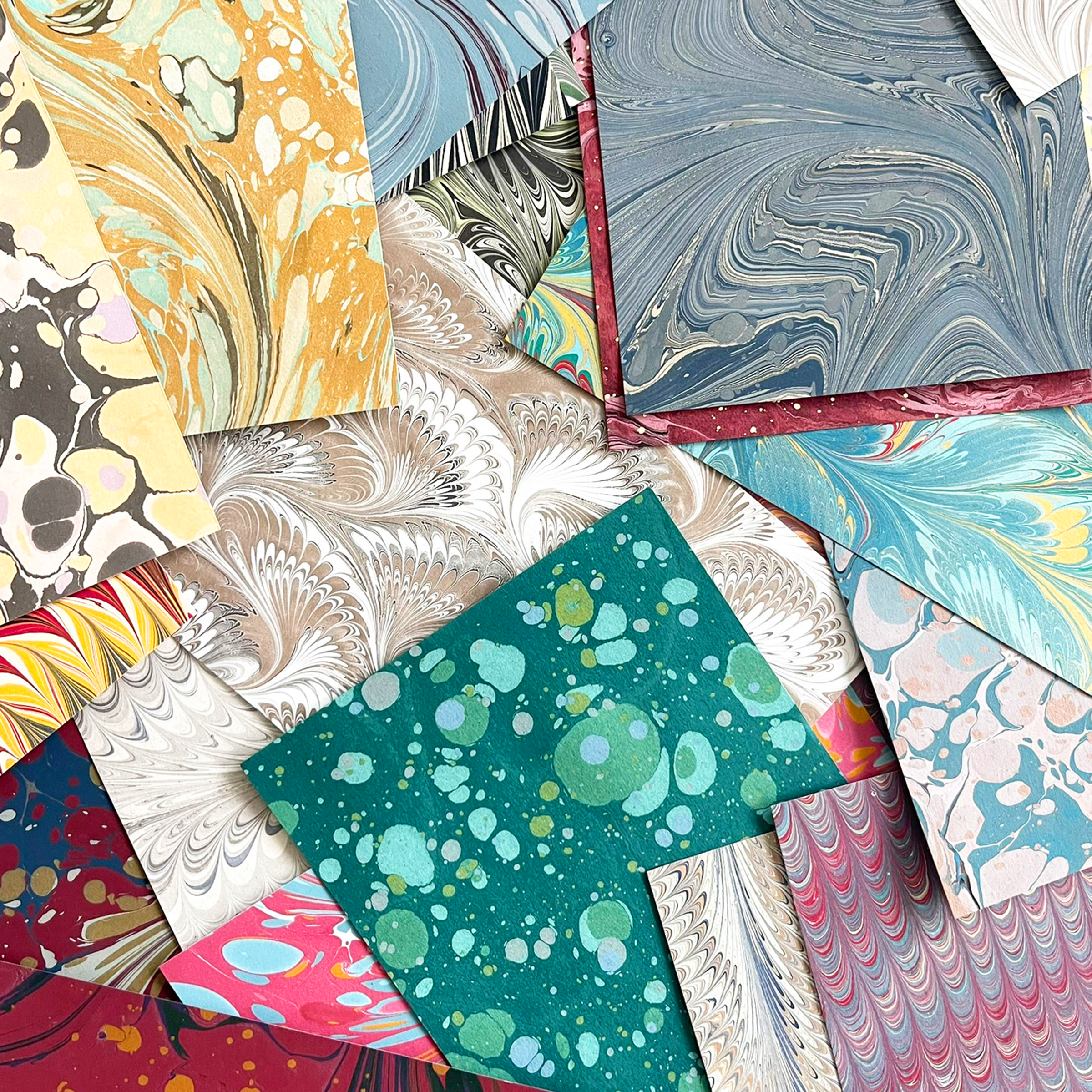 Collection of various hand marbled patterned paper sheets for sale