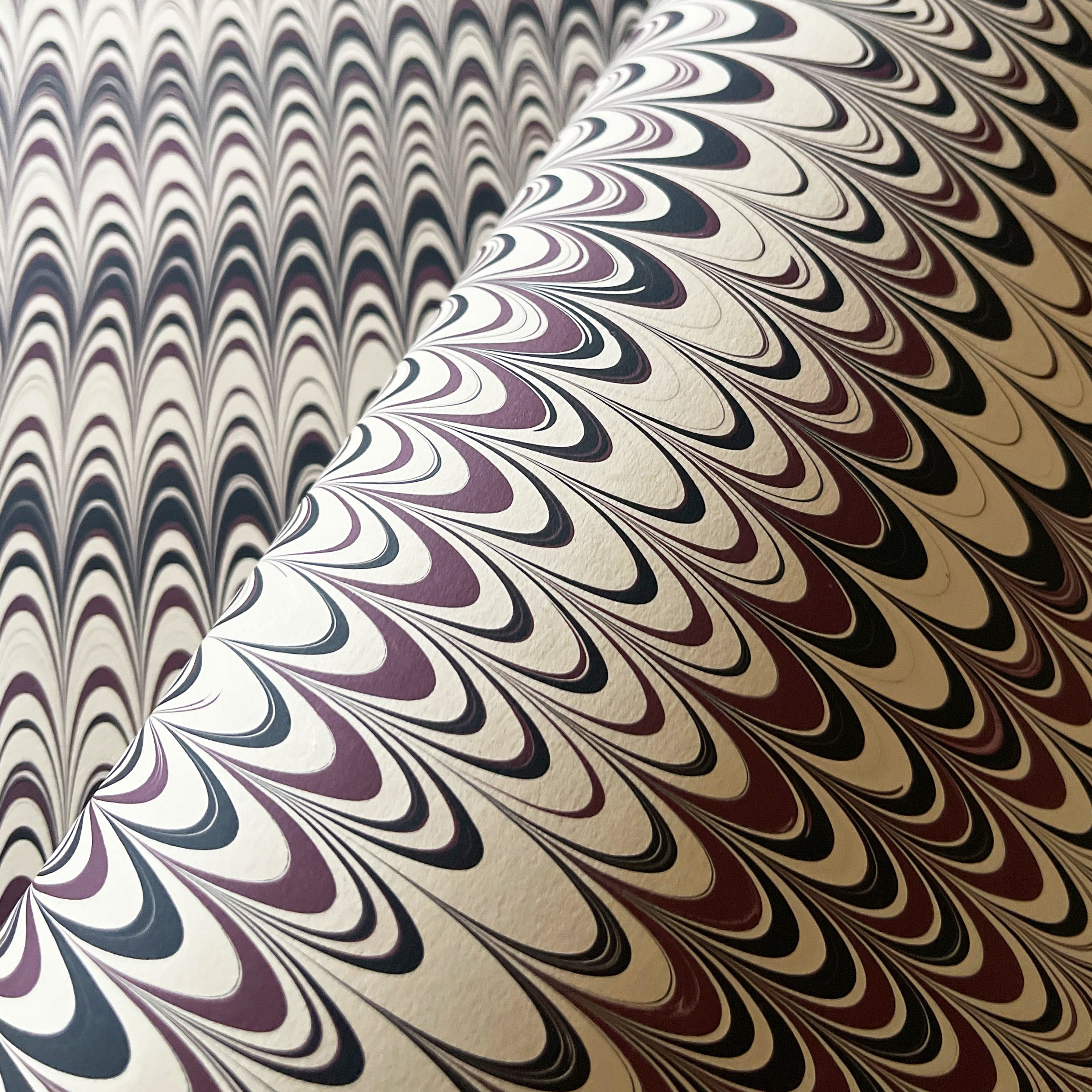 Nonpareil pattern with purple, black, and ivory colors.