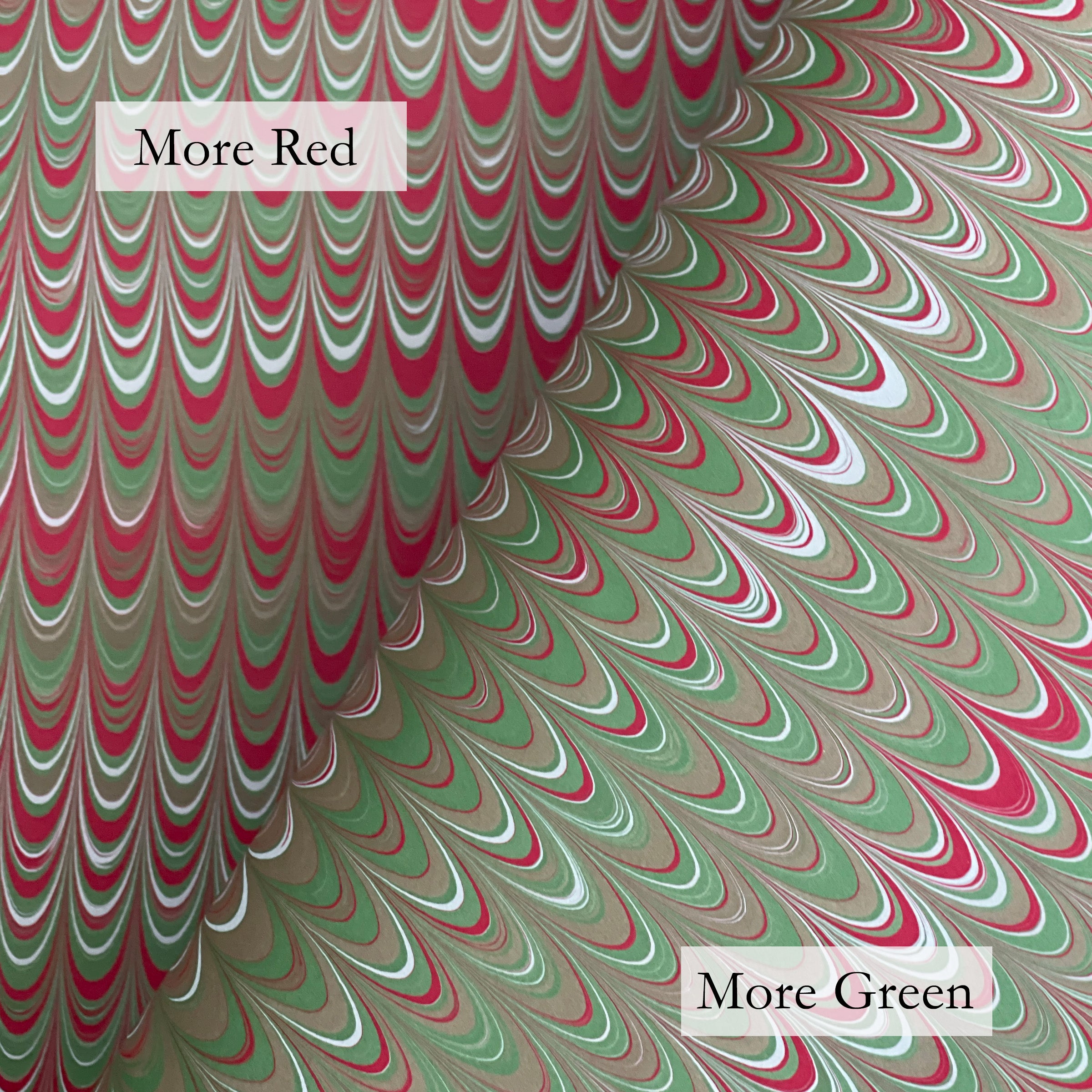 Marbled paper with red and green patterns and text labels 'More Red' and 'More Green'.