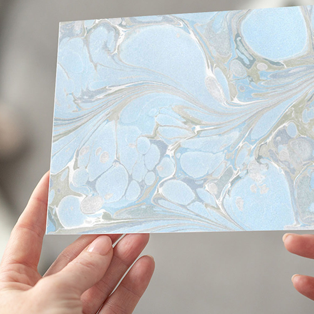 The 'Aquatic Elegance' notecard, showcasing a captivating blue pattern that exudes sophistication and charm, perfect for personalized messages and greetings.