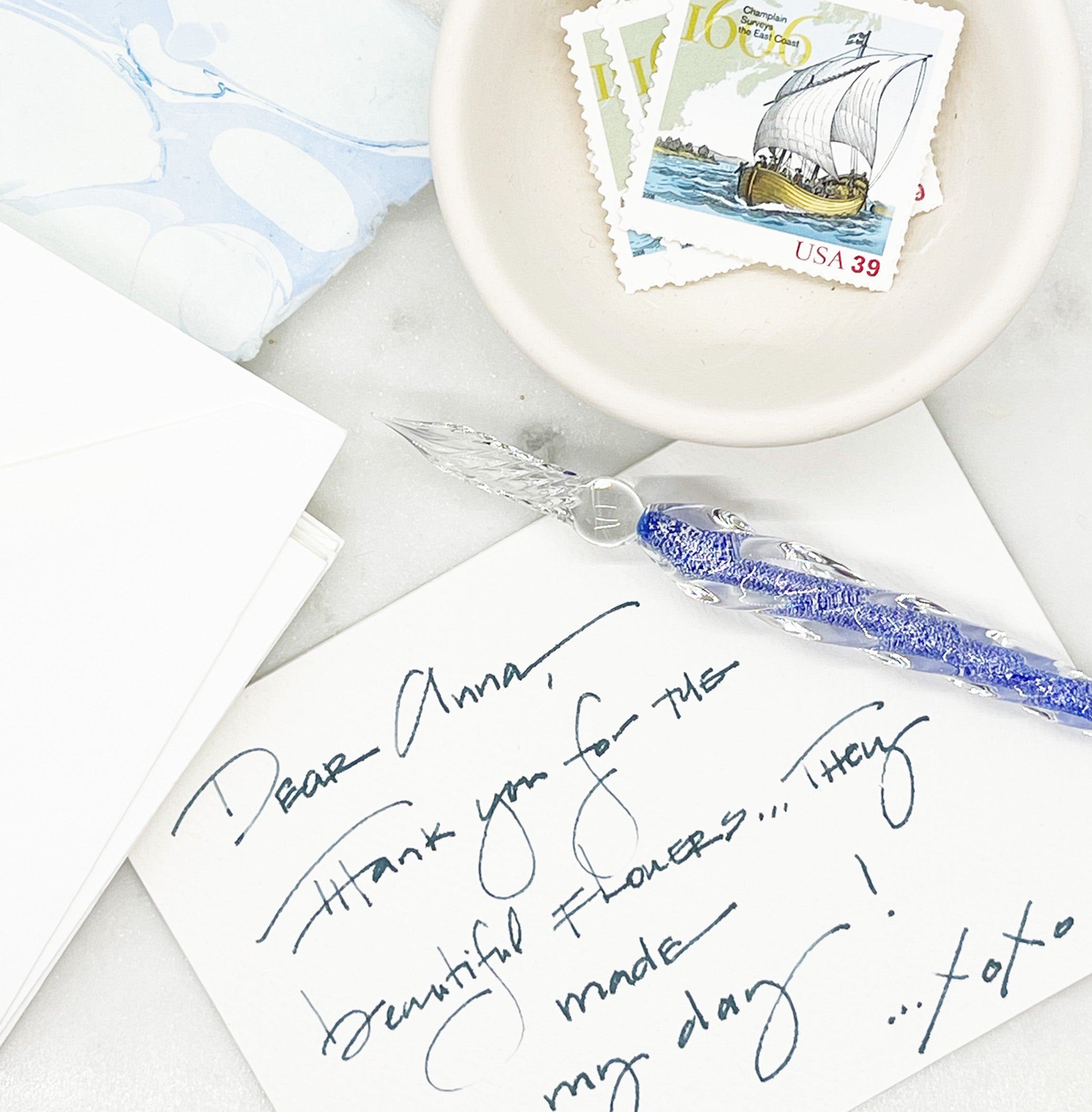 A cobalt blue glass pen, an elegant and stylish writing instrument for creative expression and fine writing