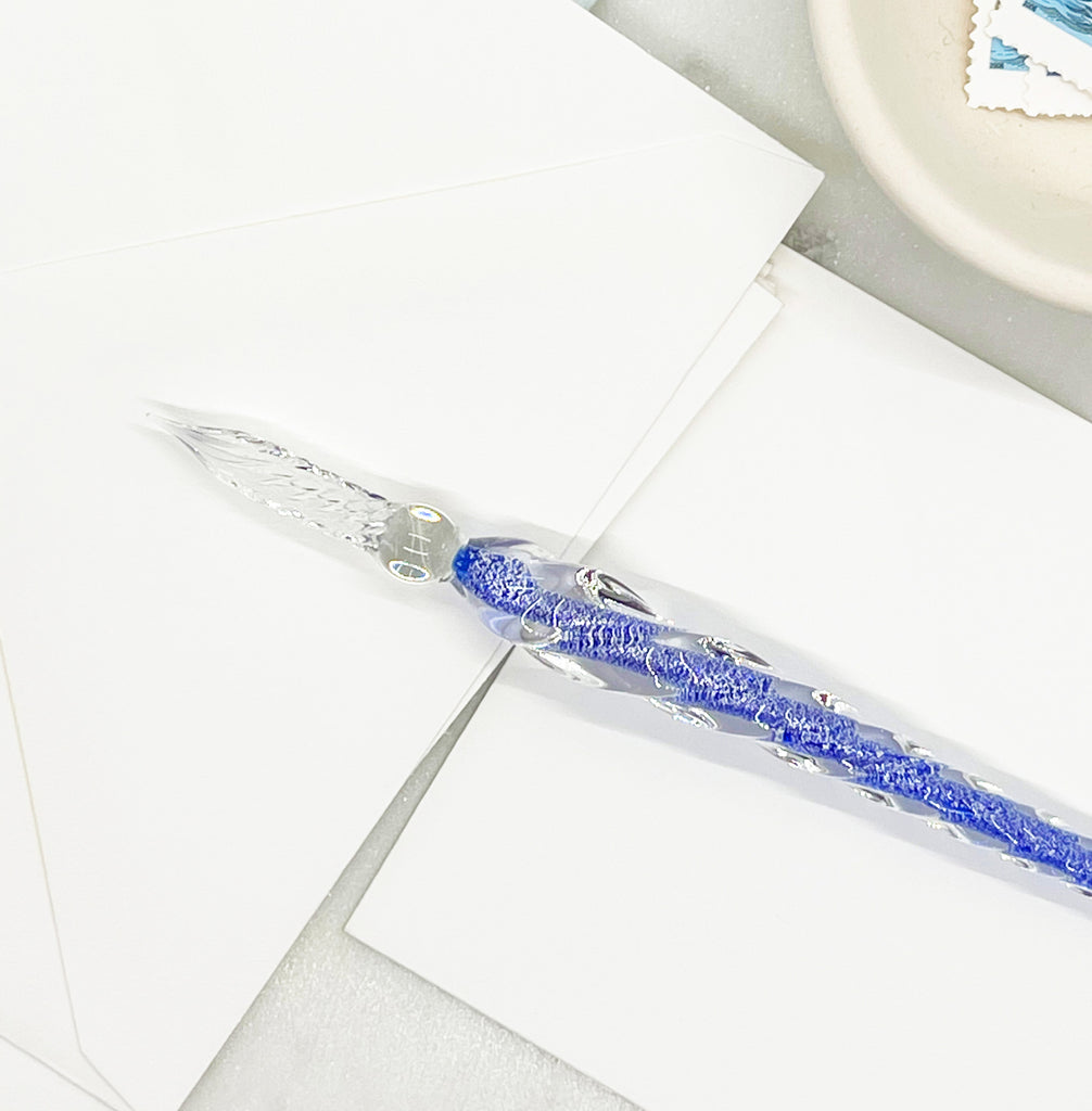A cobalt blue glass pen, an elegant and stylish writing instrument for creative expression and fine writing